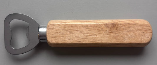 Wooden bottle opener with metal cap catcher on a gray background